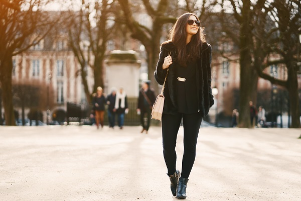 Curvy sexy French girl walking during a sunny day in a beautiful city of Paris