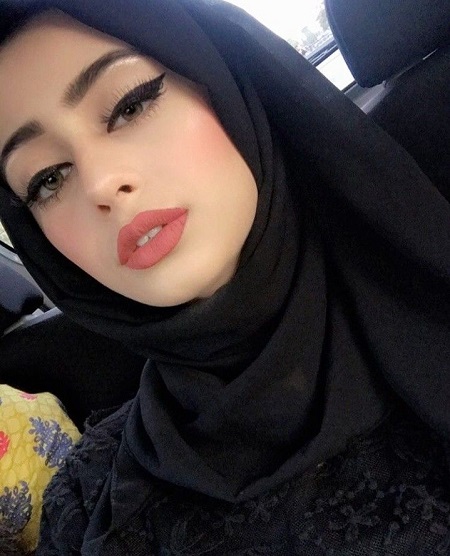 Sexy Iraqi girl wearing attractive makeup sitting in a car alone